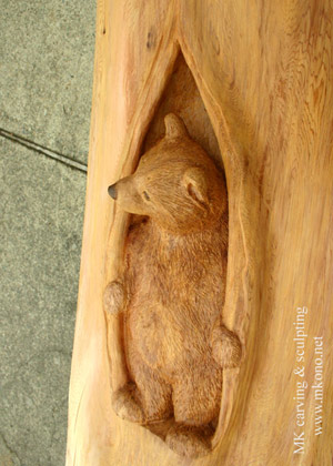 Bear in hole wood carving 2