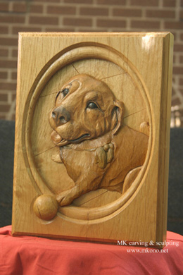 Dog relief woodcarving 2