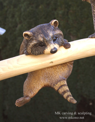 Raccoons on branch2 woodcarving 2