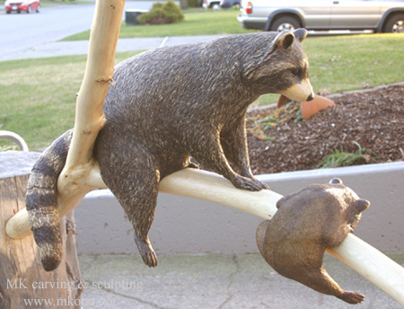 Raccoons on branch2 woodcarving 1