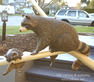 Raccoons on branch2 woodcarving 3